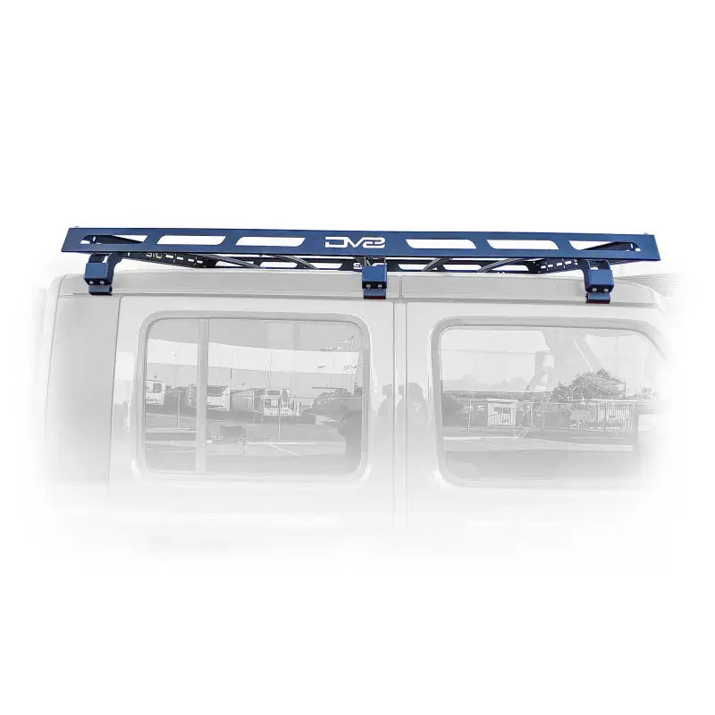 Close up of a van with a blue roof rack from DV8 Offroad Gladiator Roof Rack.