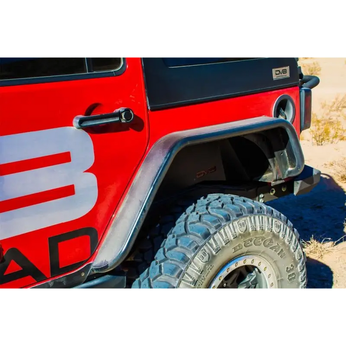 Red Jeep with bad logo on DV8 Offroad rear flat tube fenders