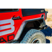 Red Jeep with bad logo on DV8 Offroad rear flat tube fenders