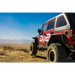 Red Jeep parked in desert, DV8 Offroad flat tube fenders