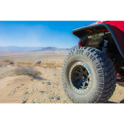 Red Honda four wheeler front wheel on DV8 Offroad flat tube fenders