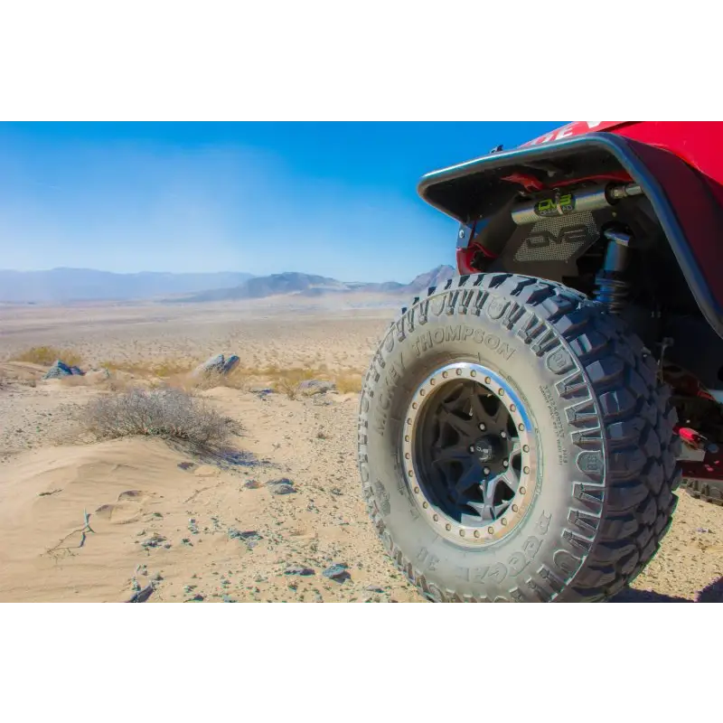 Red Honda four wheeler front wheel on DV8 Offroad flat tube fenders