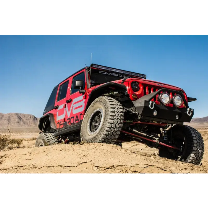 DV8 Offroad 07-18 Jeep Wrangler JK Rear Flat Tube Fenders with Red Paint Job parked in the desert