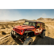 Red Jeep driving on dirt road - DV8 Offroad 07-18 Jeep Wrangler JK Rear Flat Tube Fenders