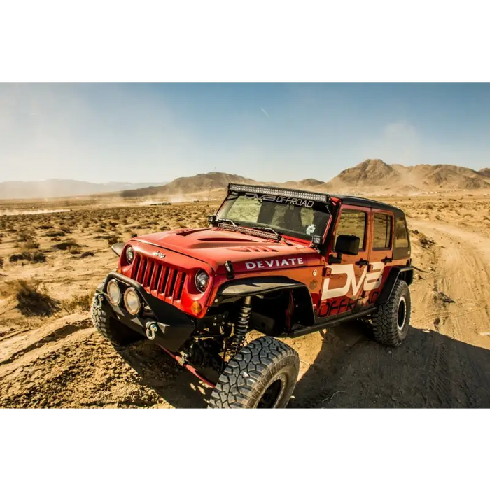 Red Jeep driving on dirt road - DV8 Offroad 07-18 Jeep Wrangler JK Rear Flat Tube Fenders