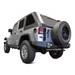 DV8 Offroad Jeep Wrangler JK Full Length Rear Bumper with large tire on white background