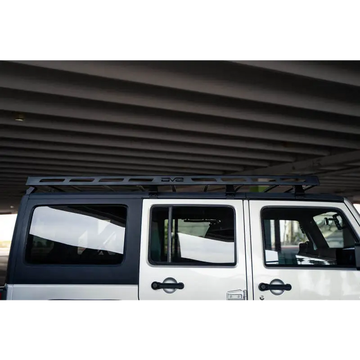 White Jeep Wrangler JK with Full-Length Roof Rack by DV8 Offroad