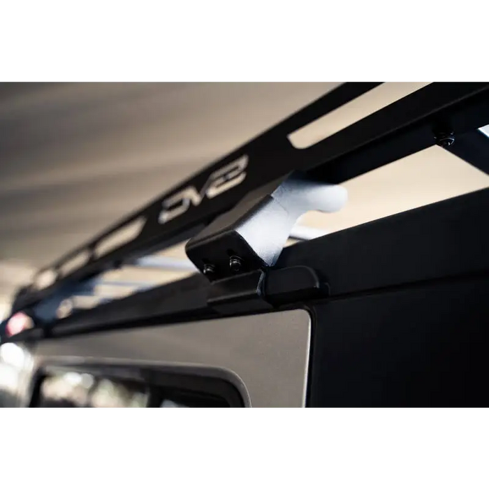 Close up of car with metal roof rack - DV8 Offroad Jeep Wrangler JK Full-Length Roof Rack