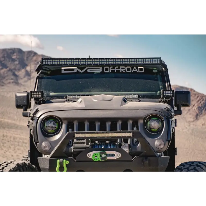 Front end of gray Jeep Wrangler JK with light bar from DV8 Offroad Metal Heat Dispersion Hood.