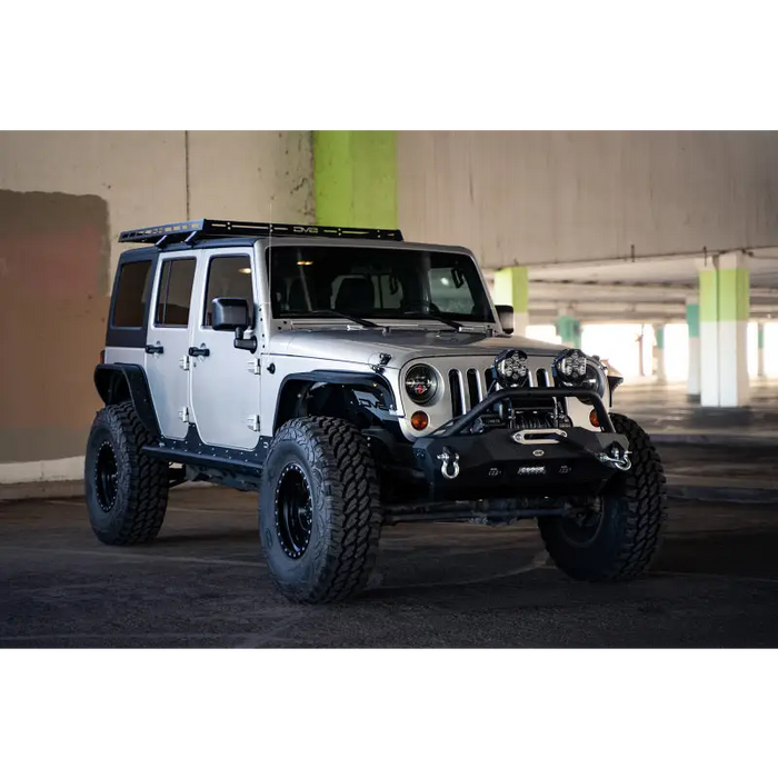 Jeep Wrangler JK Short Roof Rack parked in a garage with a green wall