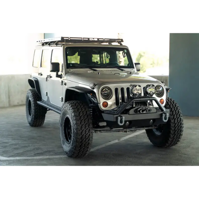 White Jeep parked in parking lot next to DV8 Offroad Slim Fender Flares for Jeep Wrangler JK