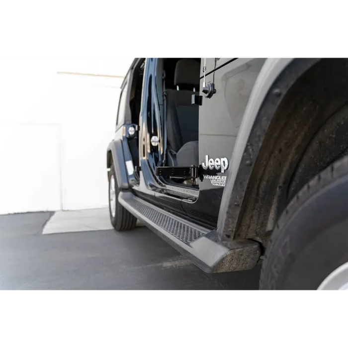 Black truck with open door - DV8 Offroad foot pegs for Jeep Gladiator Wrangler