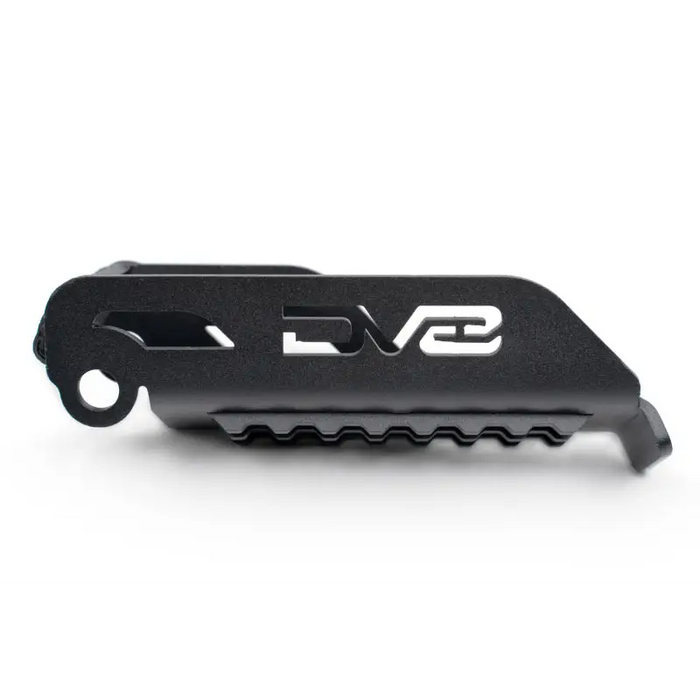 Close up of black plastic knife with white logo on DV8 Offroad 07-23 Jeep Gladiator/Wrangler foot pegs.