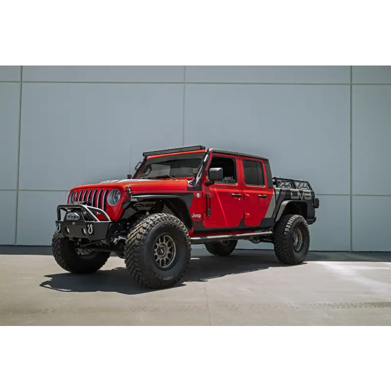 Red Jeep with black bumper and wheels - DV8 Offroad 07-23 Hinge Mounted Step