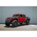 Red Jeep with black bumper and wheels - DV8 Offroad 07-23 Hinge Mounted Step