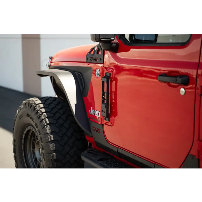 Red Jeep with black bumper and tire in DV8 Offroad 07-23 Jeep Gladiator/Wrangler JT/JK/JL Hinge Mounted Step