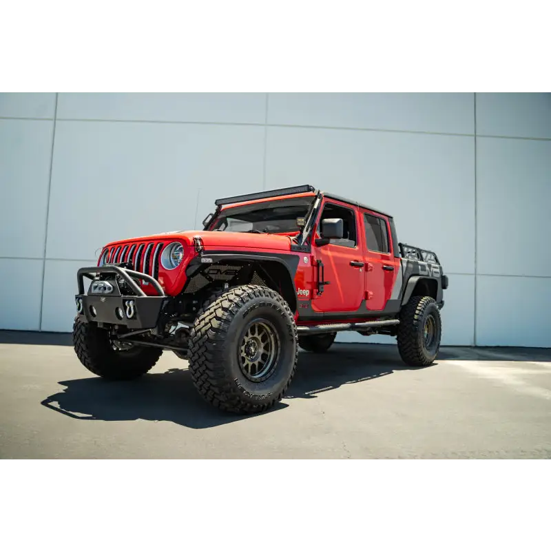 Red Jeep with black top and tires: DV8 Offroad hinge mounted step for Jeep Gladiator/Wrangler JT/JK/JL.