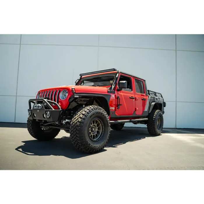 Red Jeep with black top and tires: DV8 Offroad hinge mounted step for Jeep Gladiator/Wrangler JT/JK/JL.