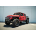 Red Jeep with black top and tires: DV8 Offroad hinge mounted step for Jeep Gladiator/Wrangler JT/JK/JL.
