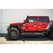 Red Jeep with black bumper and wheels: DV8 Offroad 07-23 Hinge Mounted Step for Jeep Gladiator/Wrangler.