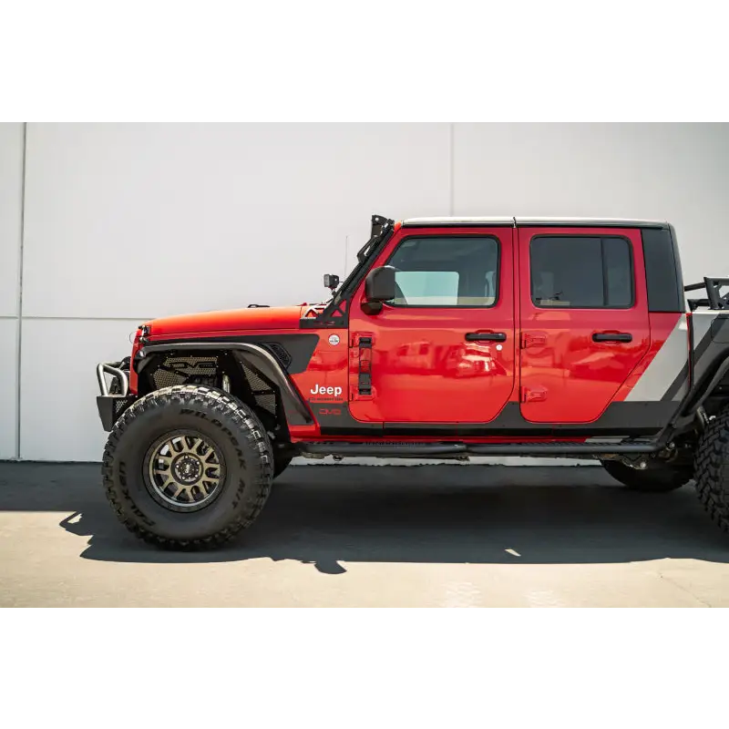 Red Jeep with black bumper and wheels: DV8 Offroad 07-23 Hinge Mounted Step for Jeep Gladiator/Wrangler.