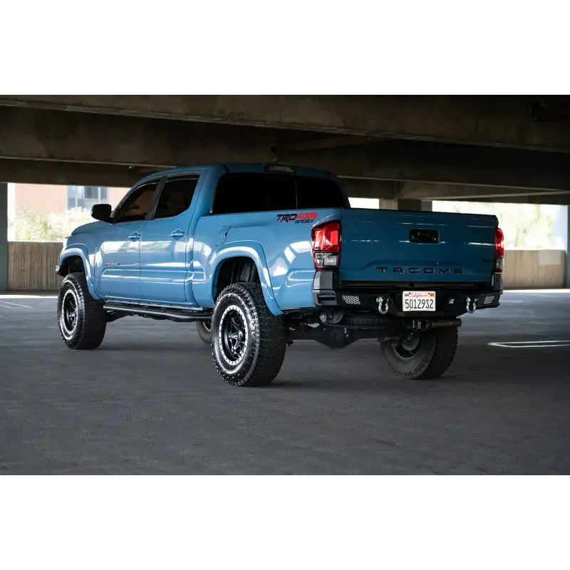 Blue truck parked under bridge, DV8 Offroad MTO Series Rear Bumper for Jeep Wrangler