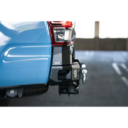 Blue pickup truck rear end with DV8 Offroad 16-23 Toyota Tacoma MTO Series Rear Bumper