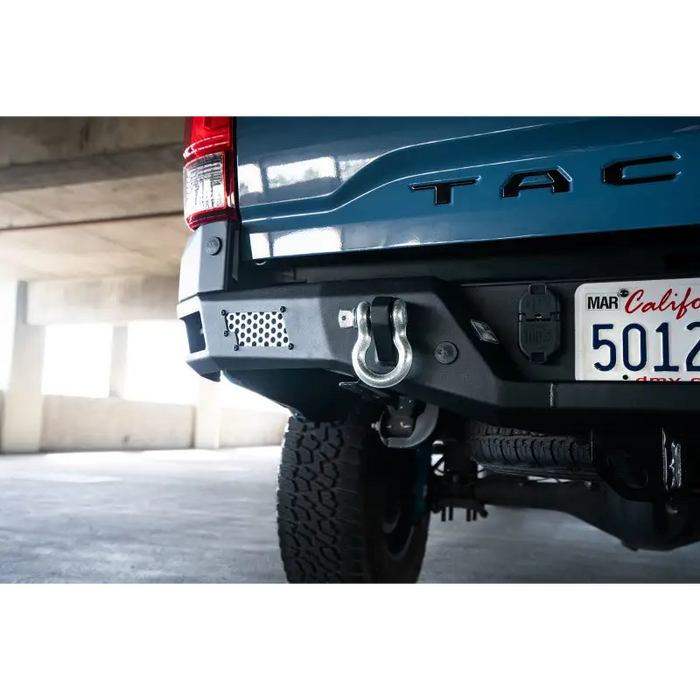 DV8 Offroad MTO Series Rear Bumper for Toyota Tacoma - Rear Bumper of Blue Truck