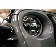 Close up of front end motorcycle LED projector headlights for Jeep Wrangler DV8 Offroad product.