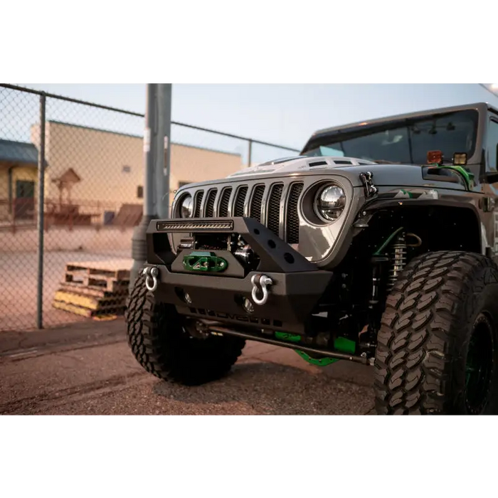 Green and black bumper on Jeep Wrangler LED Projector Headlights.