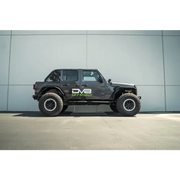 Black Jeep with Front Tire on DV8 Offroad Jeep Wrangler JL 4 Door Pinch Weld Step