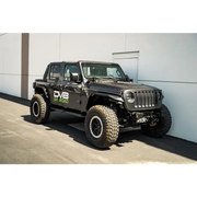 Black Jeep with Large Tire - DV8 Offroad 18-23 Jeep Wrangler JL 4 Door Body/Pinch Weld Mounted Step