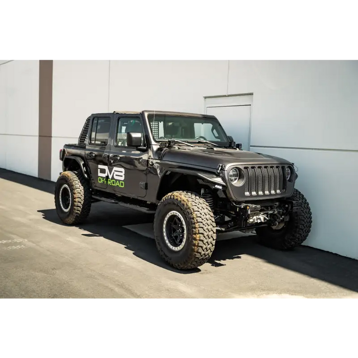 Black Jeep with Large Tire - DV8 Offroad 18-23 Jeep Wrangler JL 4 Door Body/Pinch Weld Mounted Step