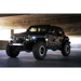 Black Jeep Wrangler JL with slim fender flares and large tire upright
