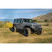 DV8 Offroad Jeep Wrangler JL Spec Series Tube Fenders on a parked Jeep WRL in a field