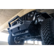 Black Jeep with big tire on DV8 Offroad Front Bumper Skid Plate for JL/JT Jeep Wrangler