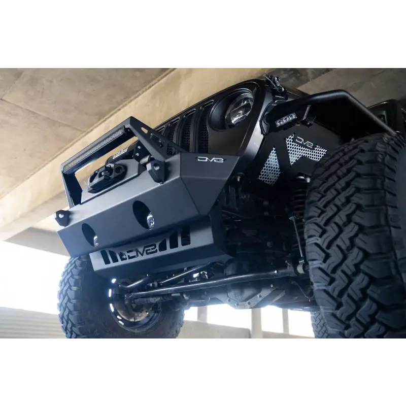 Black Jeep with big tire on DV8 Offroad Front Bumper Skid Plate for JL/JT Jeep Wrangler