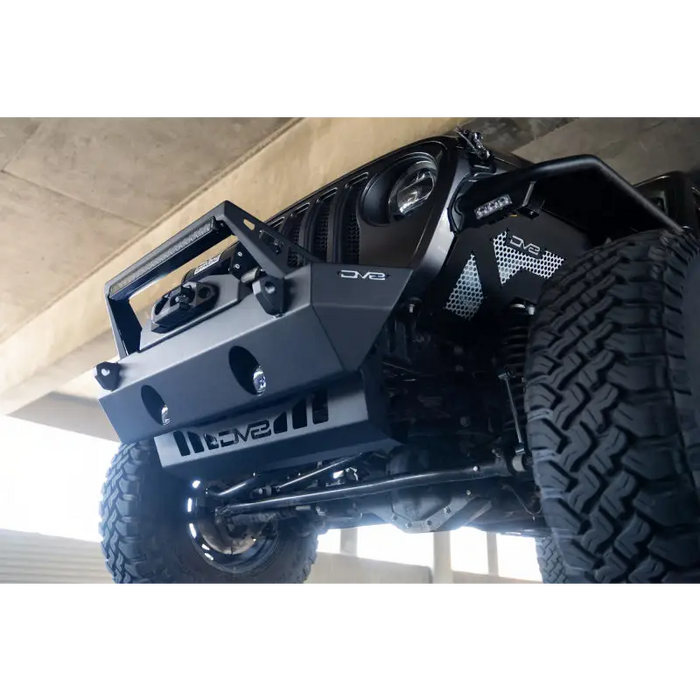 Black Jeep with big tire on DV8 Offroad Front Bumper Skid Plate for JL/JT Jeep Wrangler