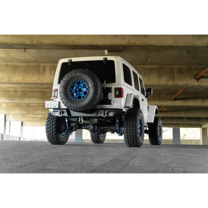 White Jeep with Blue Rim and Wheels on DV8 Offroad 18-23 Wrangler JL FS-7 Series Rear Bumper
