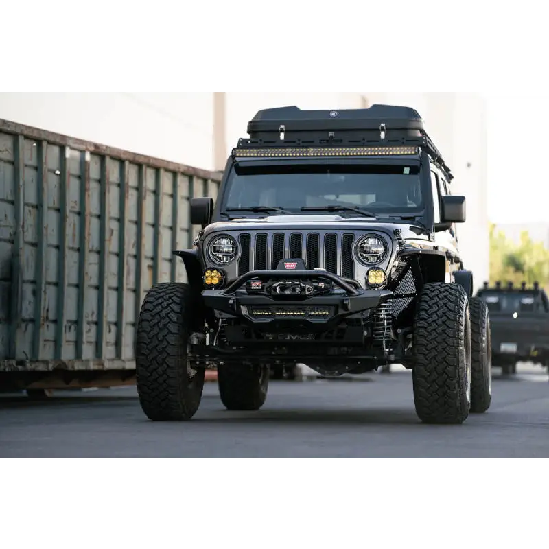DV8 Offroad Spec Series Front Bumper parked Jeep in front of shipping container