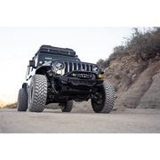 DV8 Offroad Spec Series Front Bumper on Jeep parked on dirt road