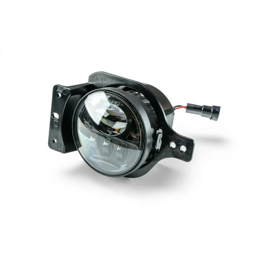 DV8 Offroad LED Fog Lights - Close up of black headlight on white background