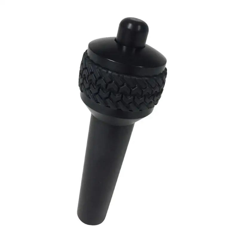Black plastic wine bottle stopper with cap on DV8 Offroad 1997-06 Jeep TJ Auto Shift Lever Black.
