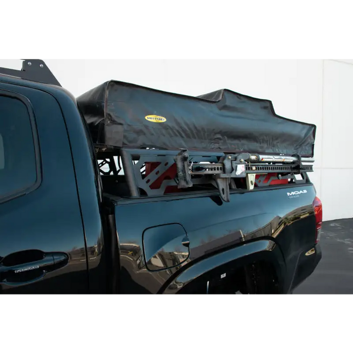 DV8 Offroad Toyota Tacoma Overland Bed Rack with black cover on truck