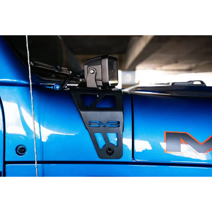 Blue car front bumper mount with dual pod light mounts