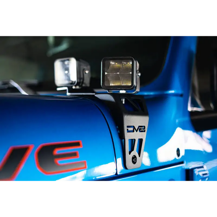 Blue race car front view with DV8 Offroad 20-22 Jeep JL 392/ Jeep JT Mojave Edition Dual Pod Light Mounts.