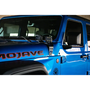Blue Jeep with DV8 Offroad Dual Pod Light Mounts.
