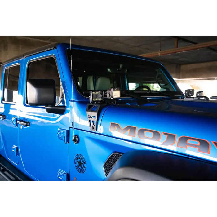 Blue Jeep with DV8 Offroad Dual Pod Light Mounts