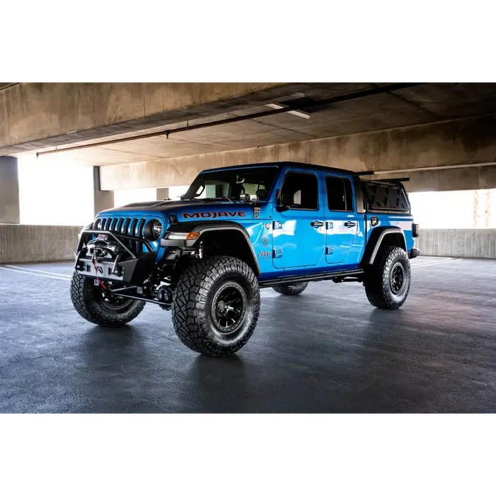 DV8 Offroad Dual Pod Light Mounts showcasing blue Arafed Jeep parked in garage