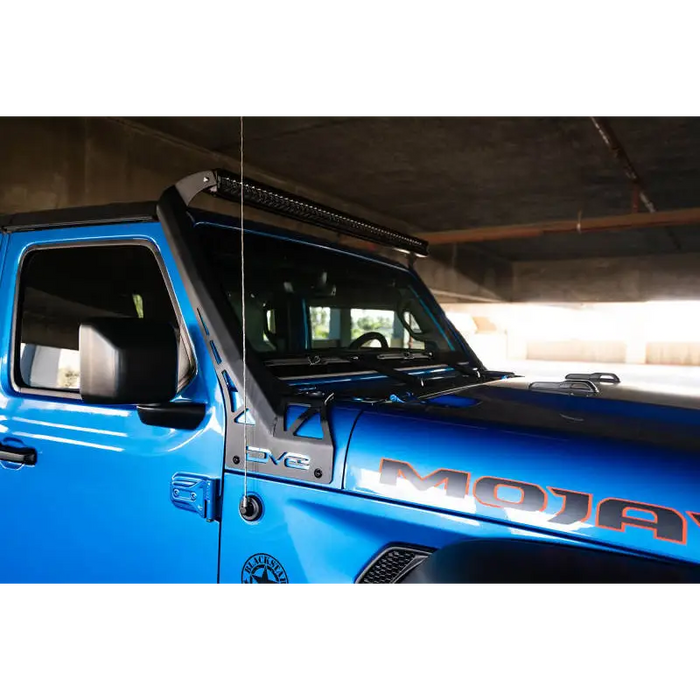 Blue truck parked in garage with DV8 Offroad A-Pillar Light Bar Mount.